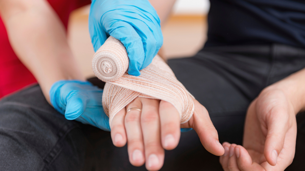 wrapping a hand with medical tape